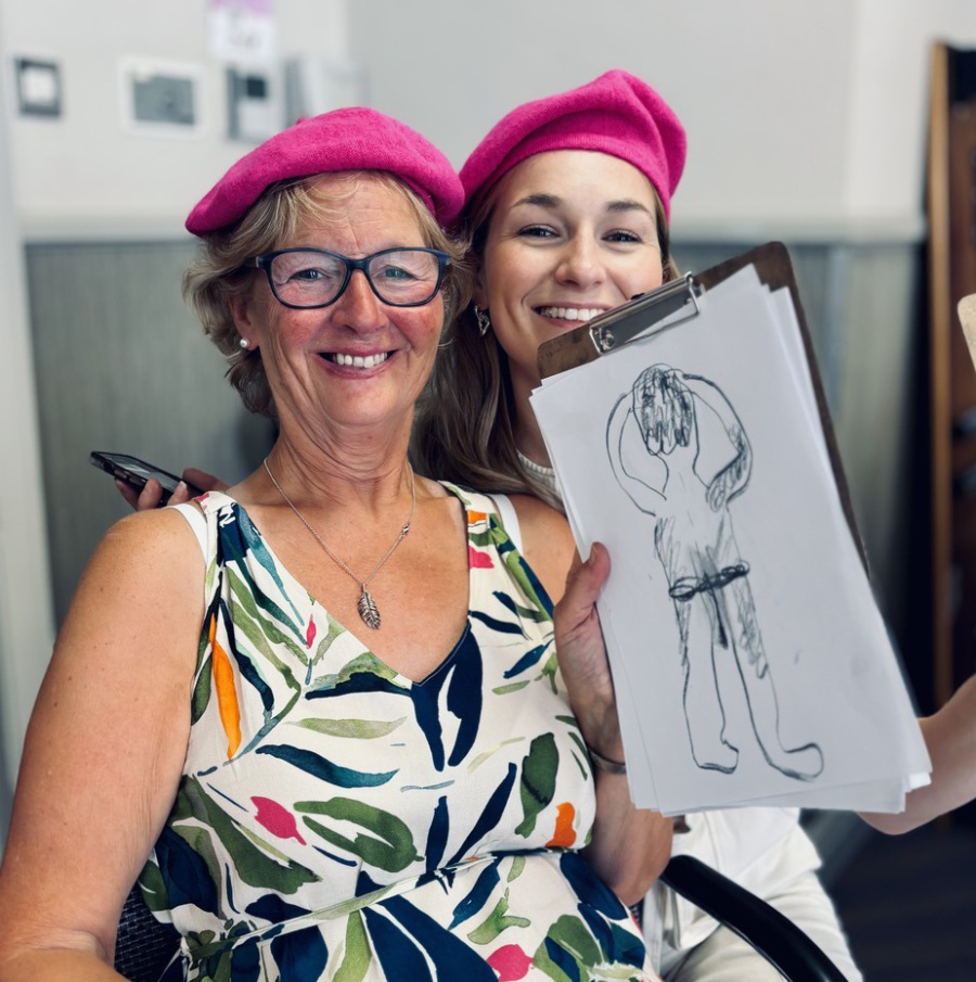 2 cheeky ladies with their sketches at artful hen