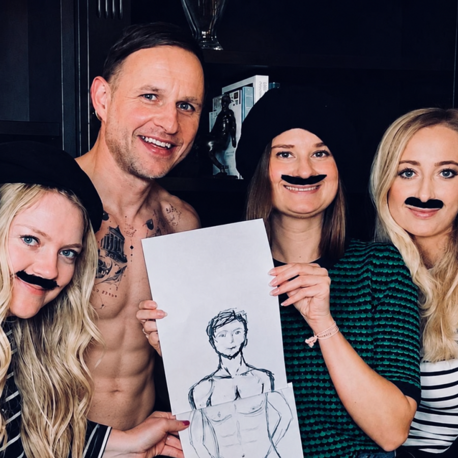 Two friends sketching together, enjoying a relaxed hen party life drawing session.